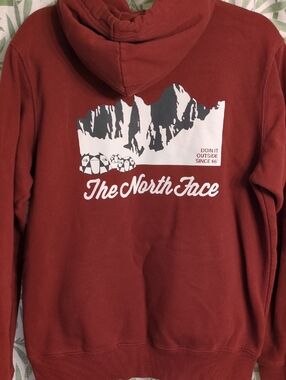 The North Face Men’s Rust Red Crewneck Hoodie with Mountain Graphic